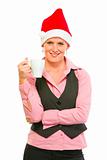 Happy modern business woman in Santa Hat with cup of coffee
