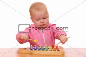 Boy plays xylophone