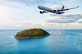 Passenger plane over tropical island