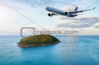 Passenger plane over tropical island