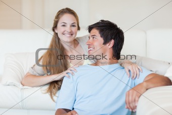 Charming couple watching television