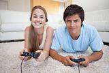 Cheerful couple playing video games