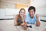 Cheerful young couple playing video games