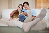 Relaxed couple watching television