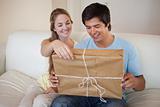 Couple opening a package