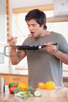 Portrait of a man tasting his meal