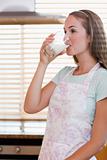 Portrait of a gorgeous woman drinking milk