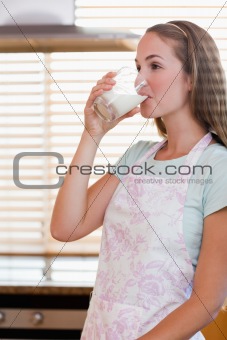 Portrait of a gorgeous woman drinking milk