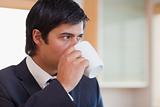 Close up of a businessman drinking tea