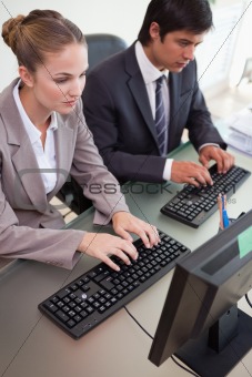 Portrait of business people working with computers