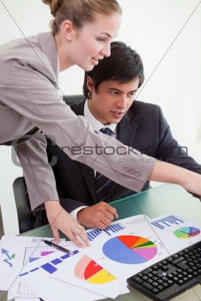 Portrait of a professional business team studying statistics
