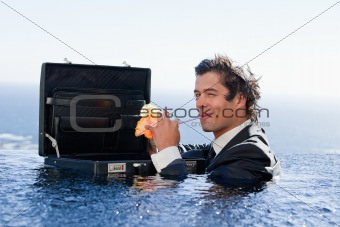 Businessman drinking a cocktail
