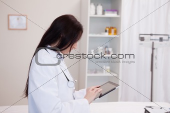 Doctor using a tablet computer