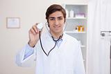 Male doctor using stethoscope