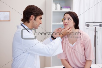 Doctor examining his patients jaw