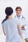 Young physician talking with patient