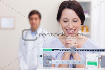 Smiling woman excited about the scale