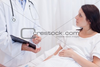 Female patient getting examination results explained