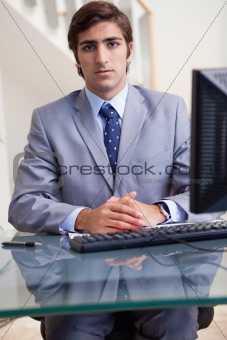 Businessman sitting behind his computer