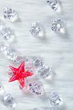 christmas red crystal star on ice cubes and fur