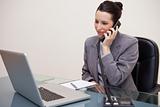 Smiling businesswoman on the telephone