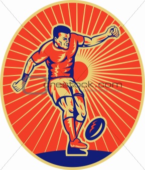 rugby player kicking the ball