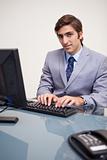Businessman typing on his keyboard