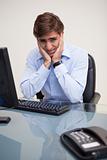 Businessman having toothache in his office