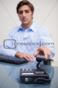 Phone being hung up by businessman