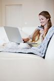 Woman on the sofa doing online shopping