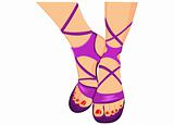Pretty female feet in purple sandals