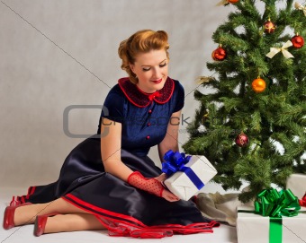 The lady next to Christmas tree