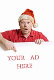Man in Santa hat and red shirt holds a white card ad sign
