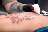 Tattoo Artist Wipes Blood 