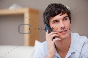 Man on the cellphone sitting in the living room
