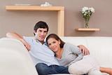 Woman leaning on her boyfriend on the sofa