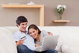Couple on the sofa shopping online