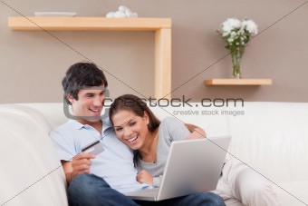 Couple on the sofa shopping online