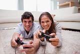 Couple playing video games in the living room