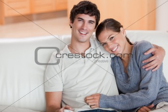 Happy couple enjoying their time together on the couch