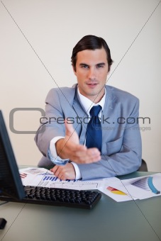 Businessman offering his hand