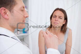 Doctor about to give an injection