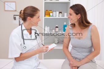 Smiling doctor with patient