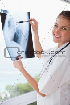 Smiling doctor with x-ray