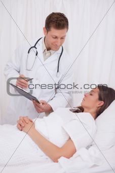 Doctor standing next to patient