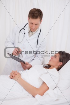 Standing doctor talking with patient