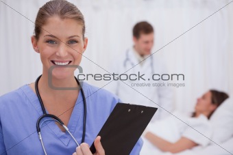 Smiling surgeon standing