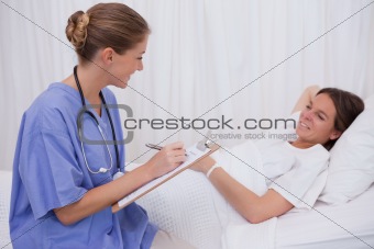Surgeon questioning patient