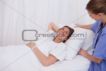 Surgeon plumping up pillow