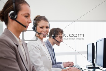 Side view of telephone service office employees